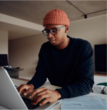 Freelancer working on a laptop at a desk