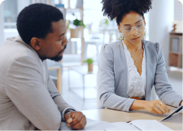 Recruiters reviewing candidate records together